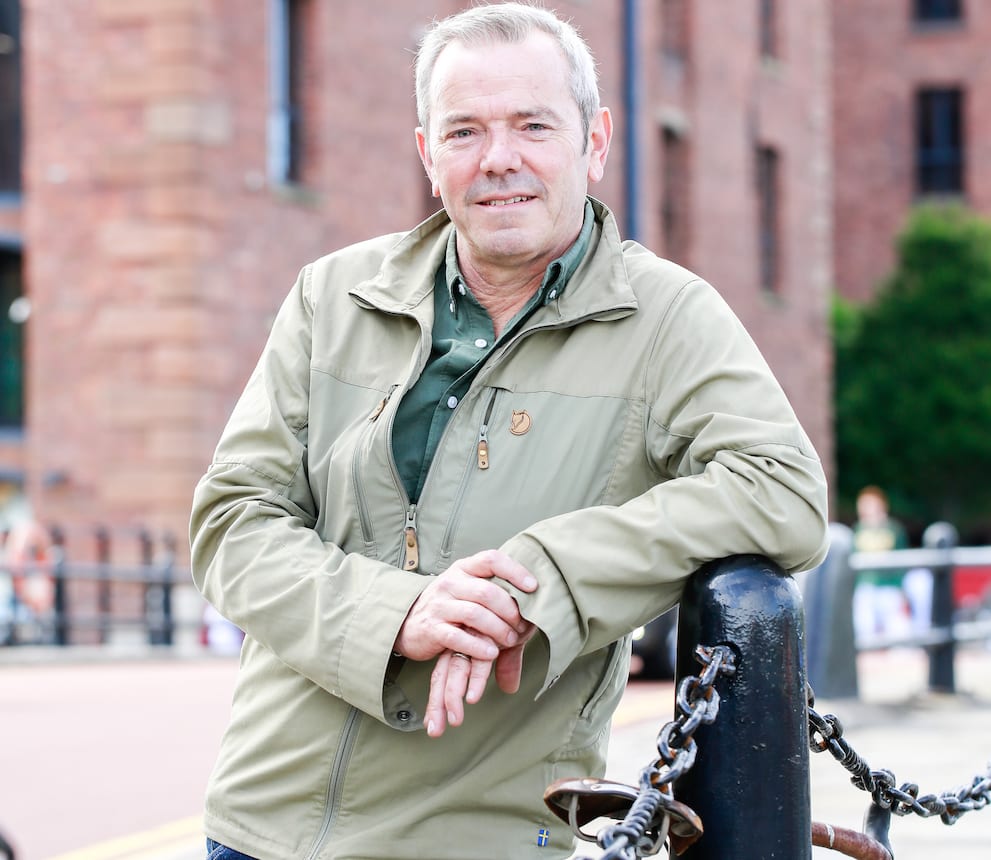Simon O Brien stands on Albert Docl iN Liverpool
